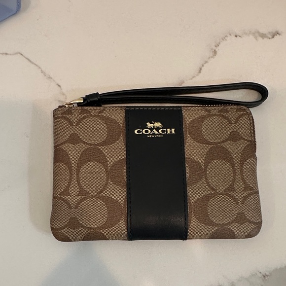 Coach Handbags - Coach Brown Signature Canvas Wristlet with Black Center Stripe